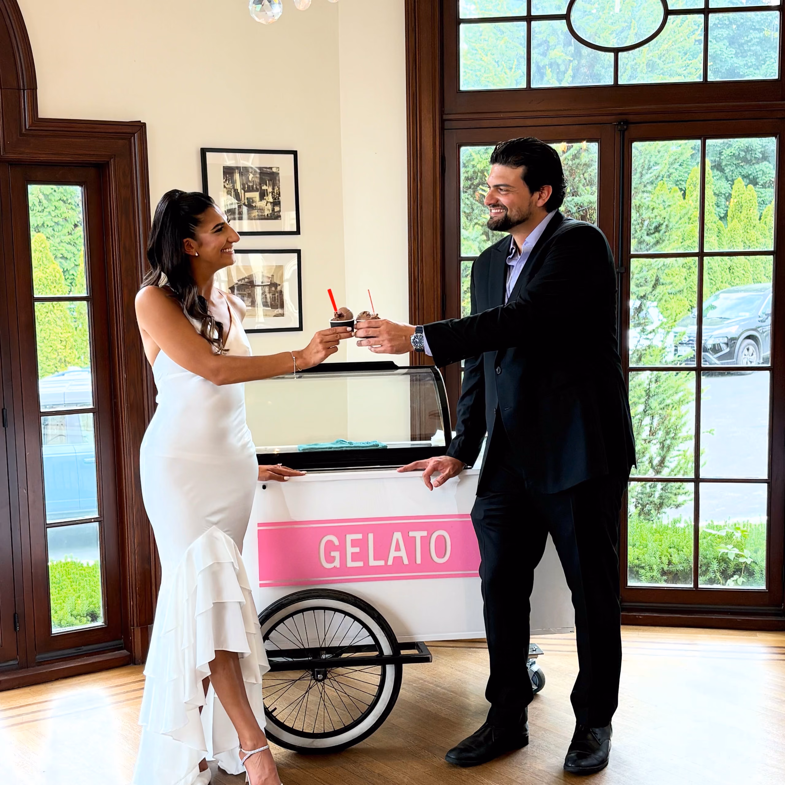 Couple enjoying gelato at their wedding